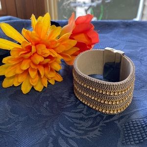 Silver toned bracelet diamond like studs